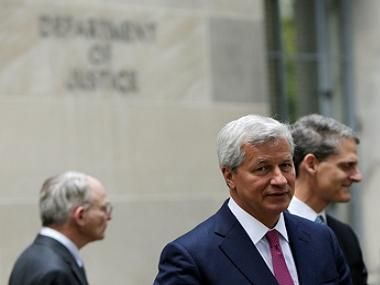 JP Morgan CEO Jamie Dimon (front) leaves the US Justice Department after meeting with Attorney General Eric Holder, in Washington