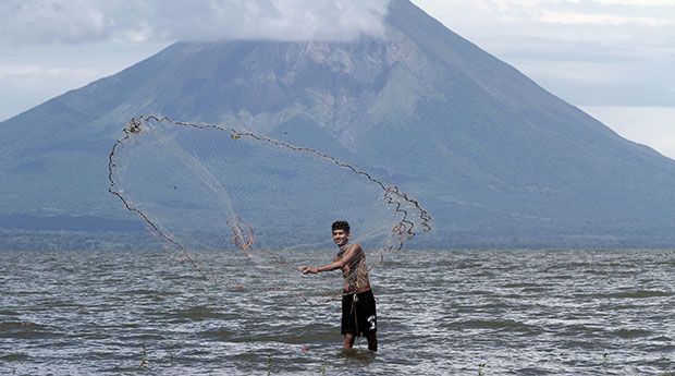 A fisherman casts a fishing net at lake Cocibolca, Nicaragua’s largest lake