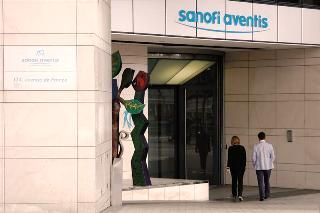 Employees enter Sanofi-Aventis headquarters in Paris