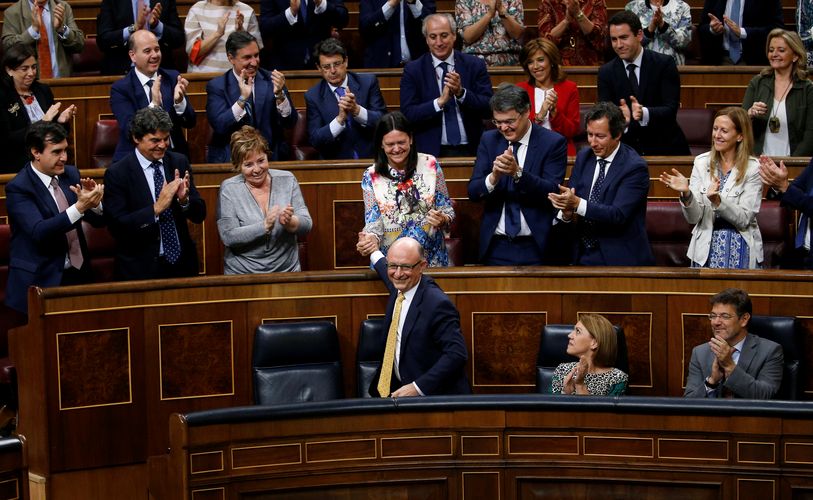 Spain’s Treasury Minister Cristobal Montoro (bottom C) at the Spanish Parliament in Madrid
