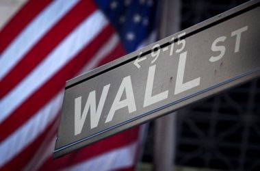 A Wall Street sign is pictured outside the New York Stock Exchange