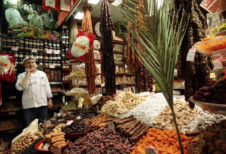 A Turkish vendor sells dates, dried fruits and spices at the Egyptian Bazaar