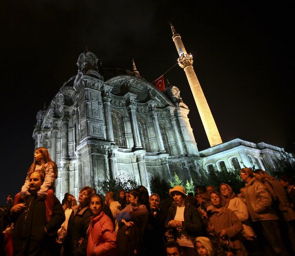 Residents gather in front of Ortakoy Mosque 