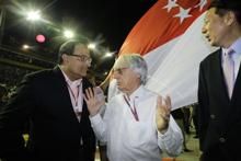 Formula One commercial supremo Bernie Ecclestone with Singapore government officials