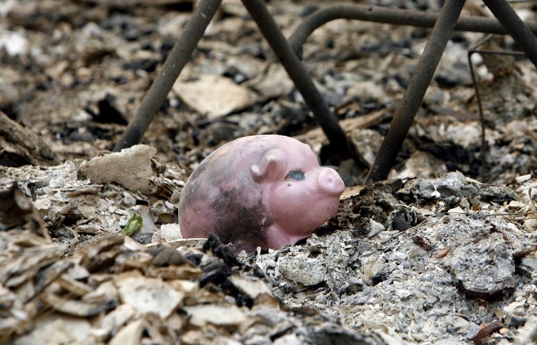 A piggy bank is seen among rubbles that burned during the Station Fire in the Tujunga area of LA