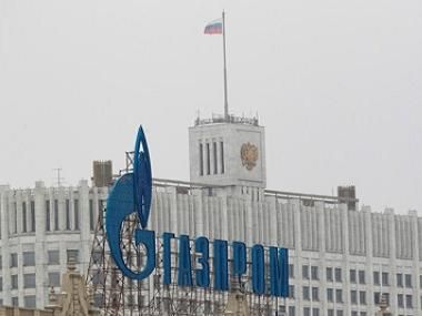The company logo of Russian natural gas producer Gazprom is seen on an advertisement in front of the White House in Moscow