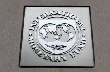The International Monetary Fund (IMF) logo is seen at the IMF headquarters building in Washington