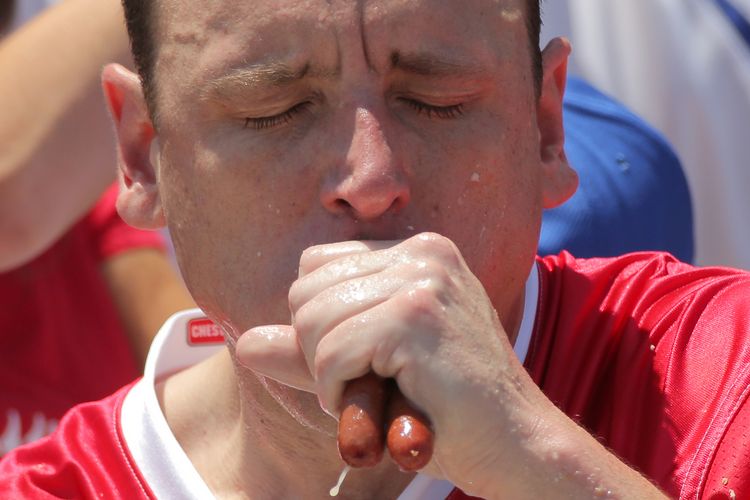 Winner Joey Chestnut competes in Nathan's Famous Fourth of July International Hot Dog-Eating Contest at Coney Island in Brooklyn, New York City, U.S., July 4, 2017