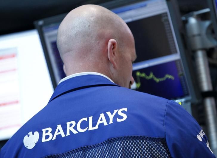 A Barclay's trader works on the floor of the New York Stock Exchange, July 3, 2012. 