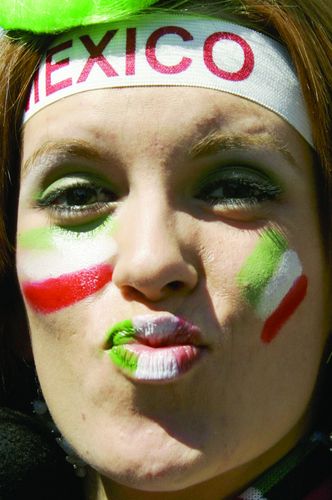 A Mexican fan poses 