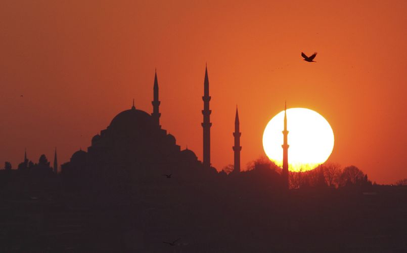 The sun sets over Ottoman-era Suleymaniye mosque in Istanbul