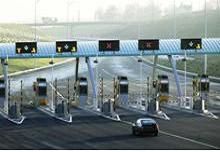 A motorist approaches toll booths on the M6 Toll motorway near Birmingham in northern England