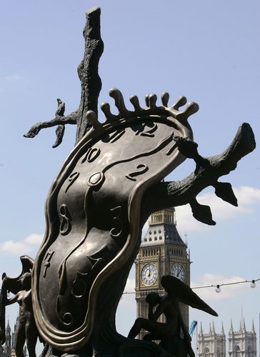 Britain's Big Ben and The Houses of Parliament are seen through a Salvador Dali sculpture of a clock