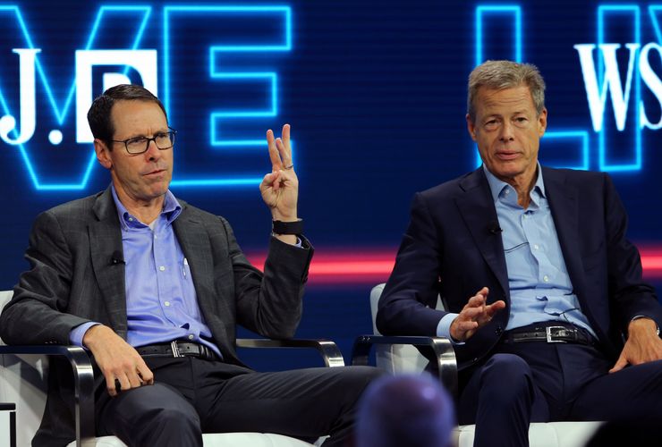AT&T CEO Randall Stephenson (L) and Time Warner Inc CEO Jeff Bewkes