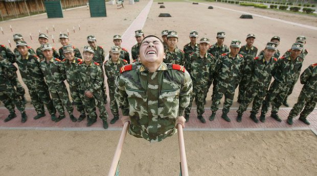 Paramilitary police for the 2008 Beijing Olympic Games take part in a training session at a military base in Shenyang