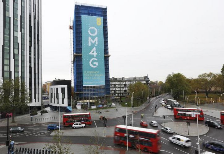 A billboard advertises 4G mobile telecom services of market leader EE