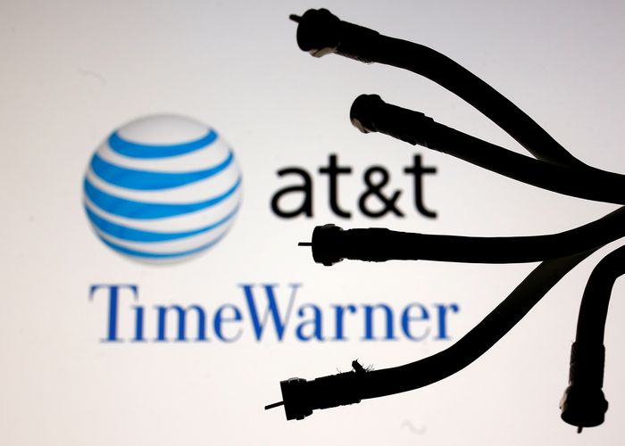 Coaxial TV Cables are seen in front of AT&T and Time Warner logos