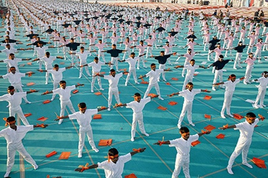 School children attend a yoga exercise session during a camp in the western Indian city of Ahmedabad.
