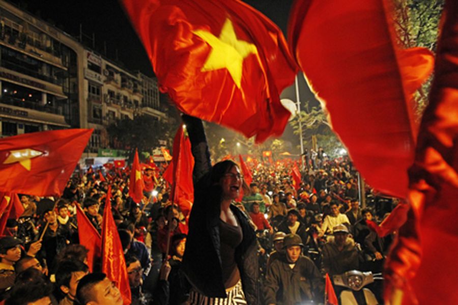Vietnamese soccer fans gather on the street to celebrate their victory over Singapore in 2010. 