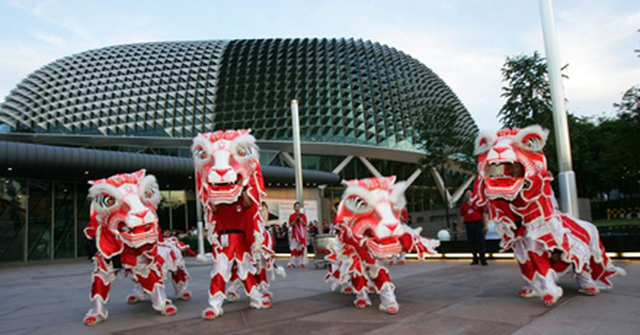 A lion dance troupe performs outside Singapore's Esplanade. 