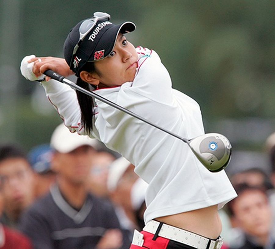Ai Miyazato of Japan watches her tee shot on the first hole during the first round of the Mizuno Classic LPGA Official Tournament at the Seta Golf Course in Otsu, western Japan.