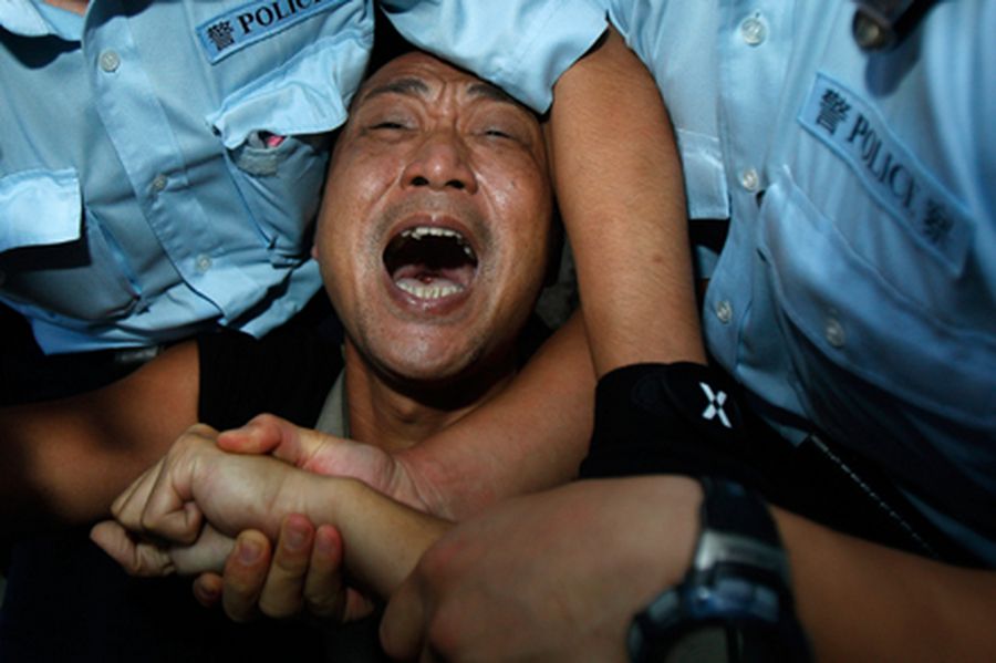 Hong Kong police arrest a pro-democracy protester during a demonstration in Hong Kong